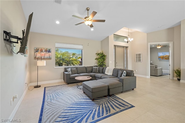 living room featuring ceiling fan with notable chandelier and light tile floors