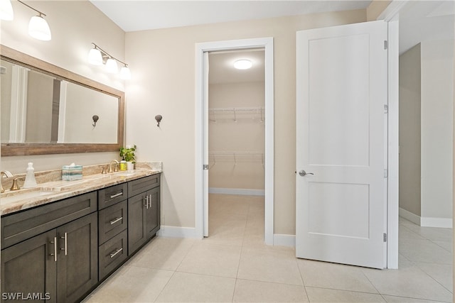 bathroom featuring dual bowl vanity and tile floors