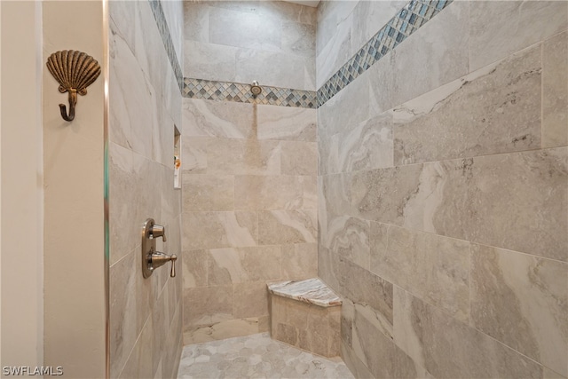 bathroom featuring tiled shower