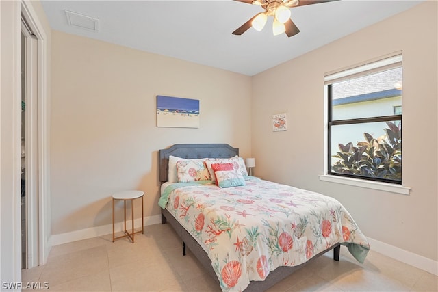 bedroom with ceiling fan and tile flooring