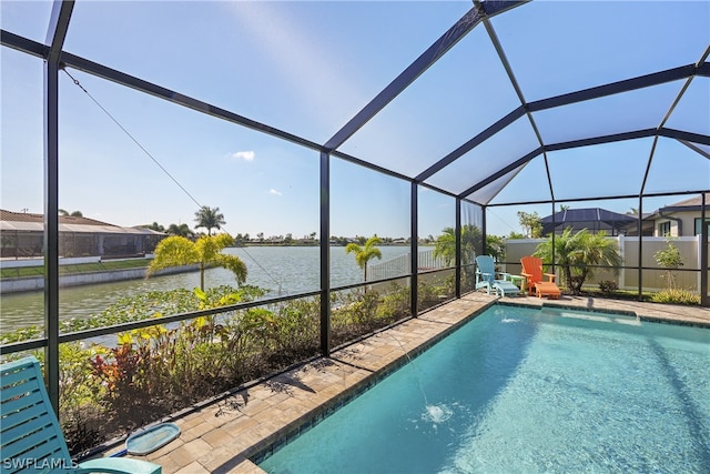 view of swimming pool featuring a water view and glass enclosure