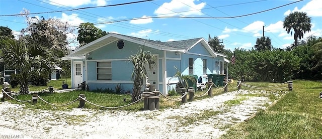 view of property exterior with a yard