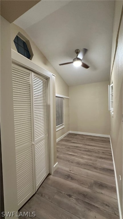 interior space with lofted ceiling, ceiling fan, and hardwood / wood-style flooring