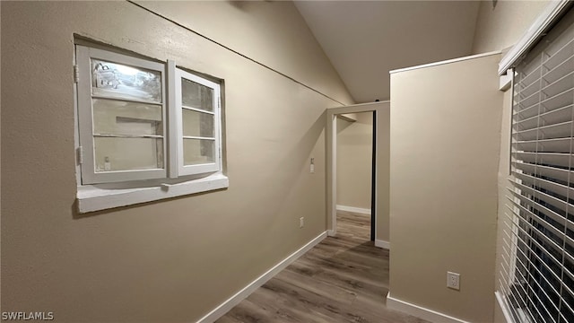 interior space with vaulted ceiling and hardwood / wood-style flooring