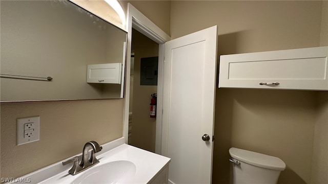 bathroom featuring vanity and toilet