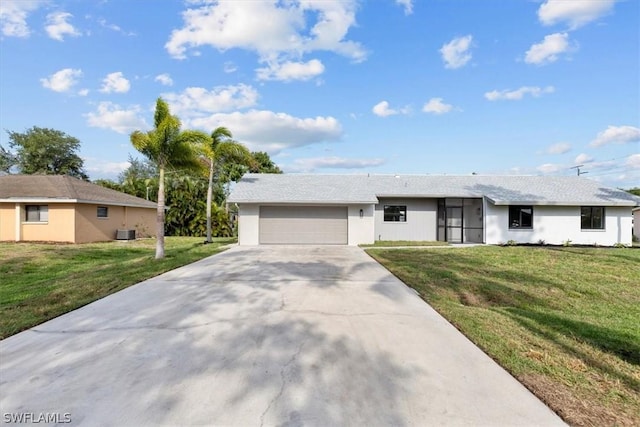 single story home featuring a garage, a front yard, and cooling unit