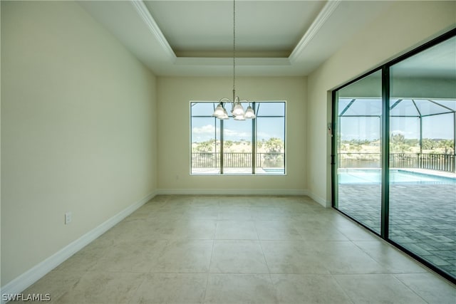 unfurnished dining area featuring a notable chandelier, light tile flooring, and a tray ceiling