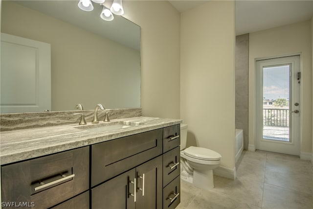 bathroom with oversized vanity, toilet, and tile flooring