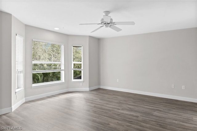 unfurnished room featuring ceiling fan and hardwood / wood-style flooring