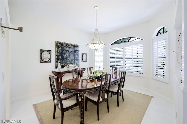 dining area with light tile patterned floors