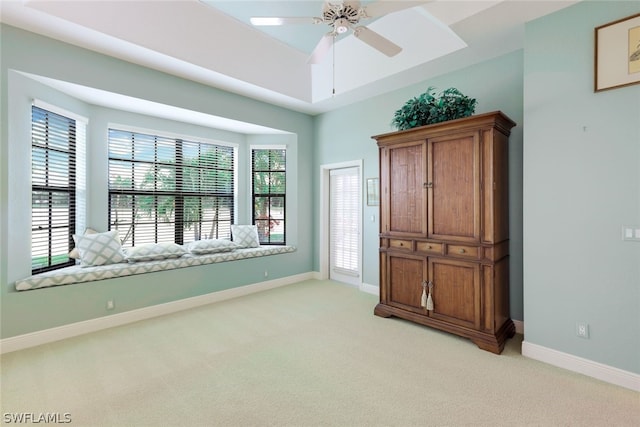 unfurnished bedroom featuring light carpet and ceiling fan