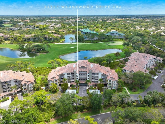 bird's eye view featuring a water view and golf course view