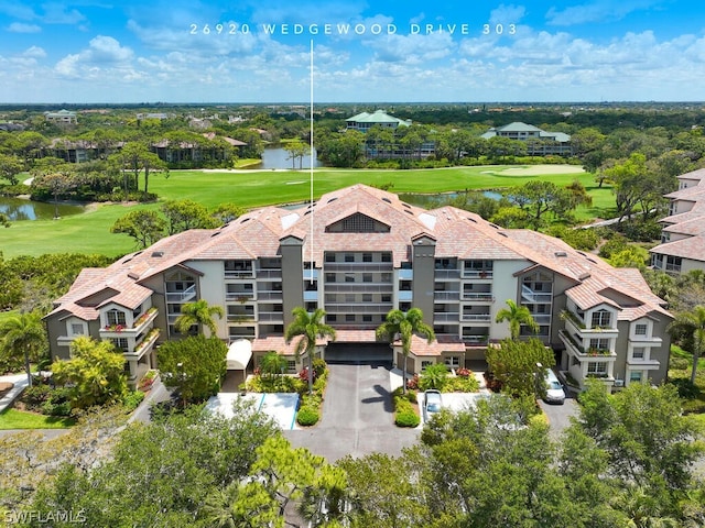 bird's eye view with golf course view and a water view