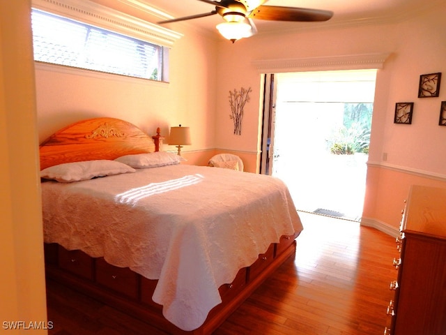 bedroom with access to exterior, ceiling fan, crown molding, and hardwood / wood-style flooring