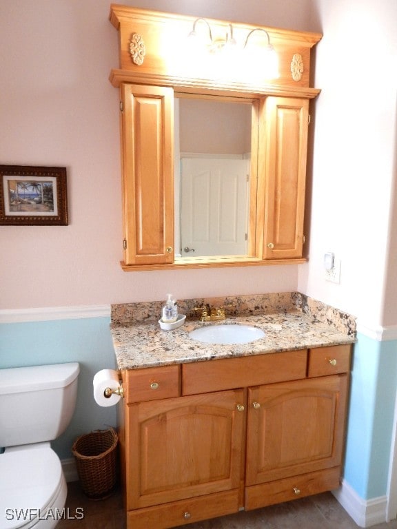 bathroom with vanity and toilet