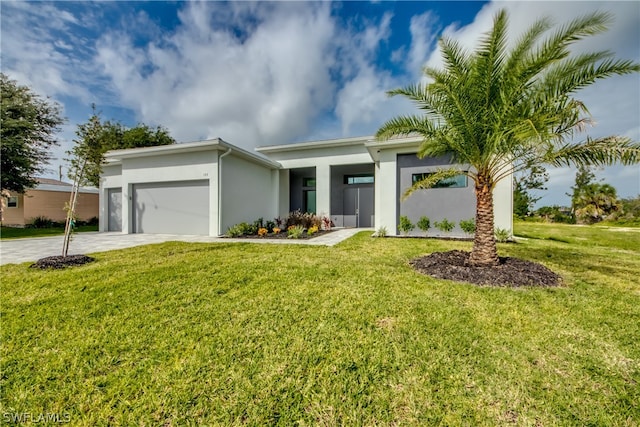 view of front facade with a garage and a front lawn