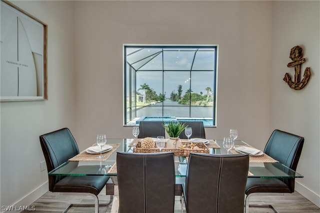 dining area with light hardwood / wood-style floors