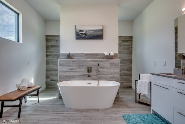 bathroom featuring tile walls, vanity, and tile floors