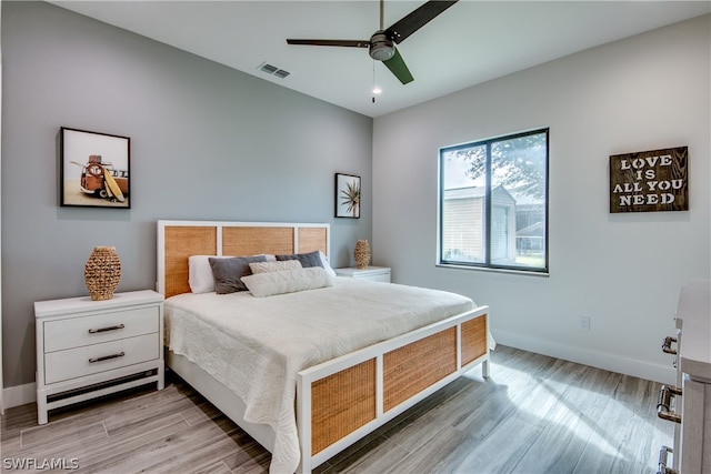 bedroom featuring ceiling fan and hardwood / wood-style flooring