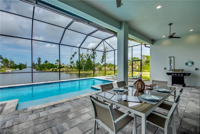 view of pool featuring a patio, a lanai, and ceiling fan