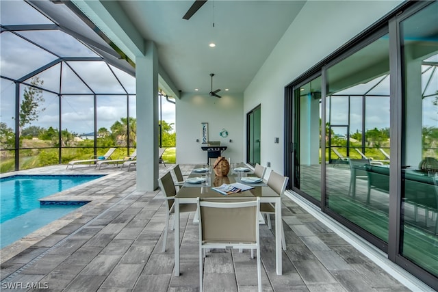 exterior space with ceiling fan and a swimming pool