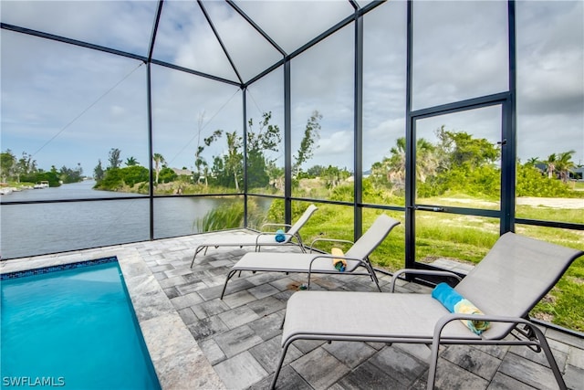 unfurnished sunroom with a water view