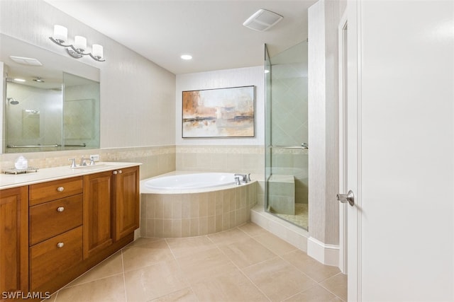 bathroom featuring vanity, separate shower and tub, and tile patterned floors