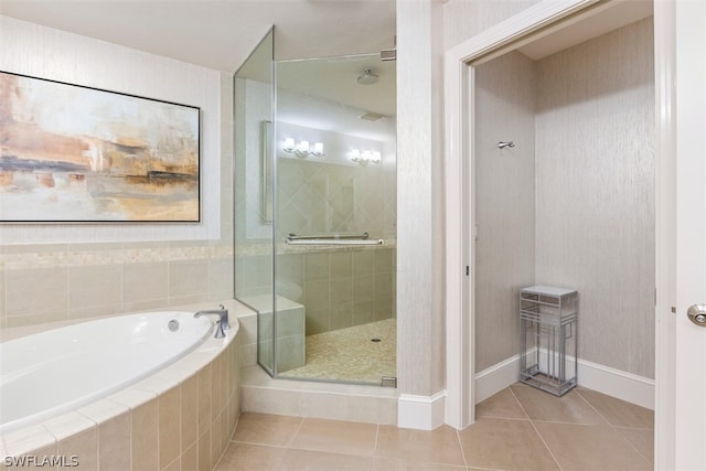 bathroom featuring tile patterned flooring and independent shower and bath