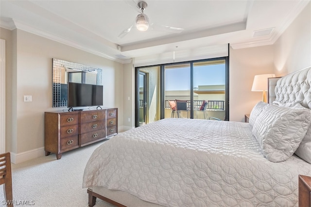 carpeted bedroom featuring access to outside, ceiling fan, crown molding, and a tray ceiling