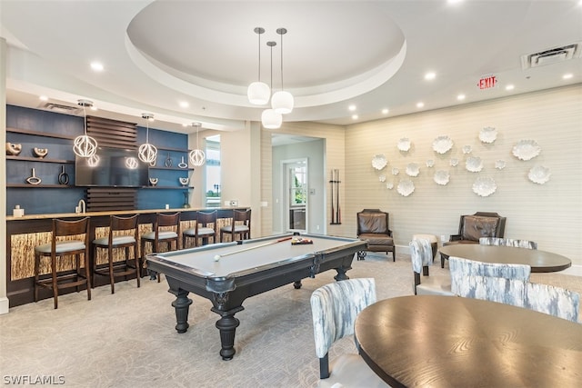 recreation room featuring a raised ceiling, light carpet, billiards, and indoor bar