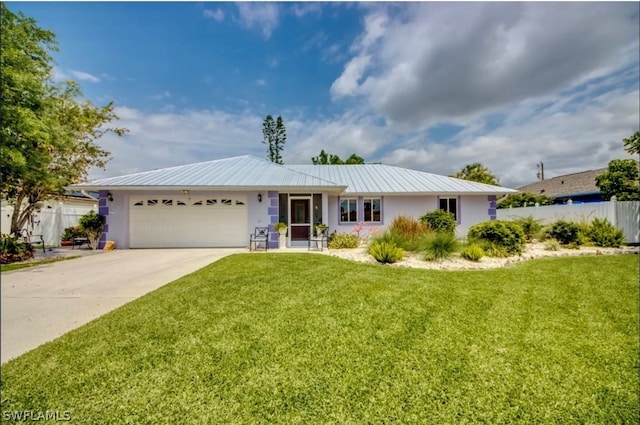 ranch-style house featuring a front yard and a garage