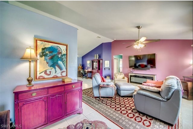 tiled living room with ceiling fan and lofted ceiling