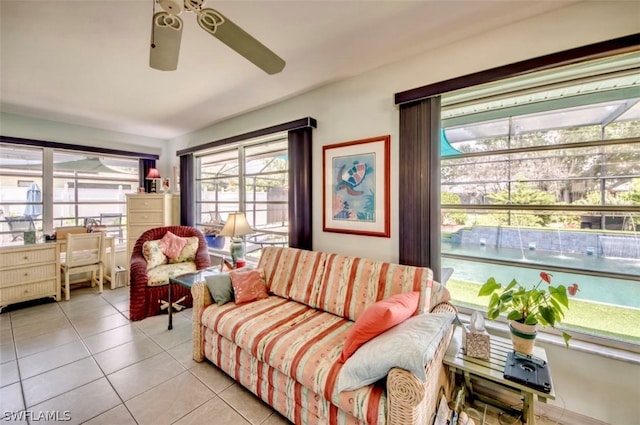 tiled living room with ceiling fan