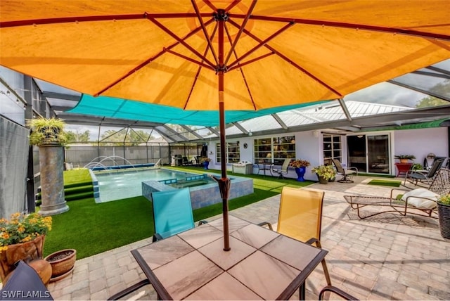 view of patio with pool water feature and a fenced in pool