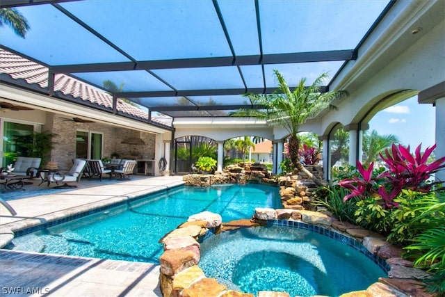 view of swimming pool with glass enclosure, an in ground hot tub, a patio area, ceiling fan, and an outdoor hangout area