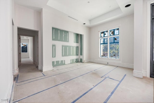 spare room featuring a tray ceiling