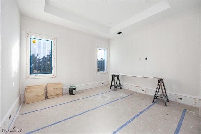 spare room with a tray ceiling