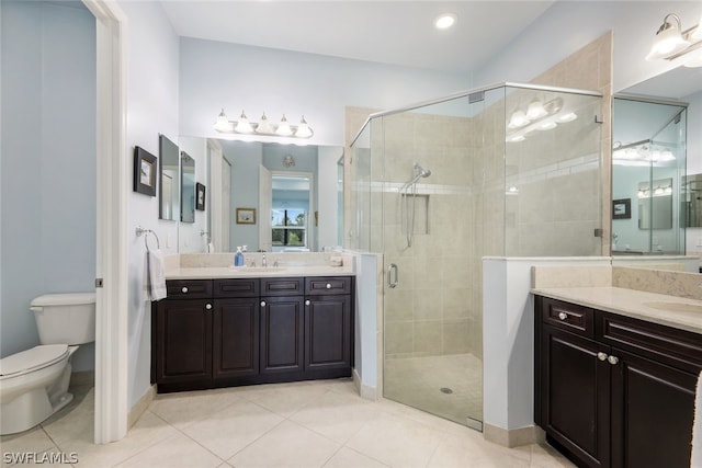 bathroom with an enclosed shower, vanity, and tile floors