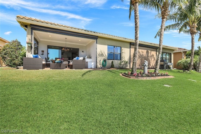 rear view of property with an outdoor hangout area and a lawn