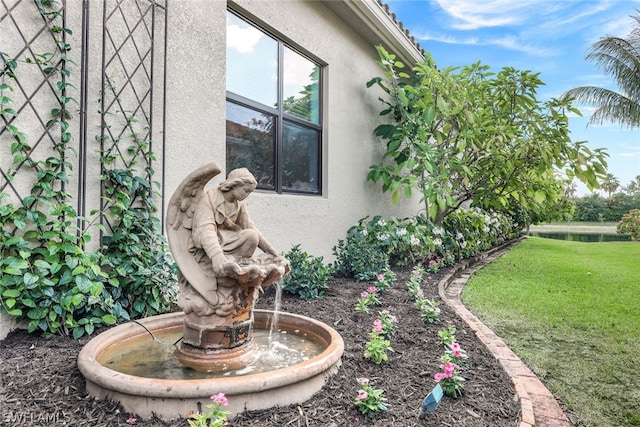 view of side of property with a yard