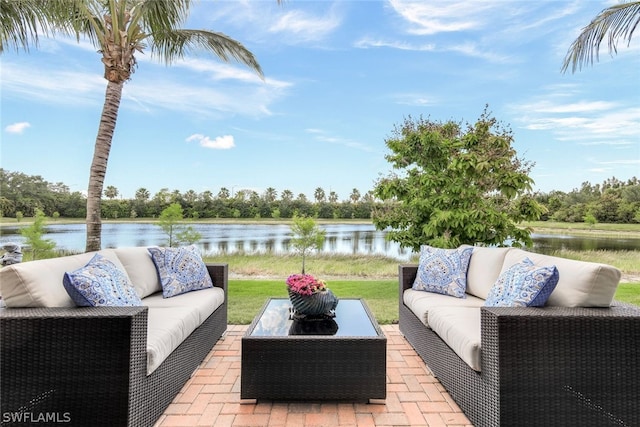 view of patio / terrace featuring a water view and an outdoor hangout area