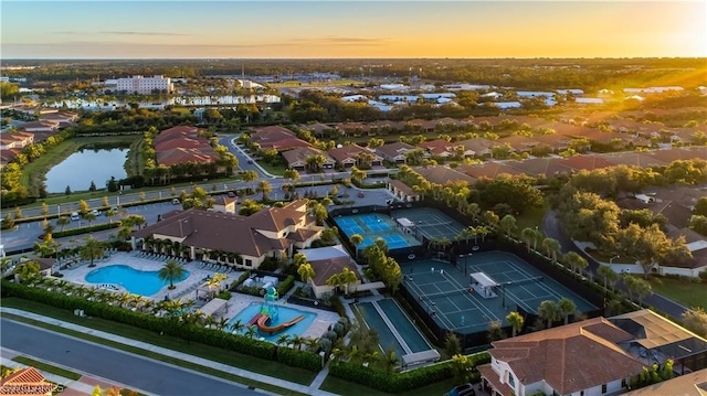 aerial view at dusk with a water view