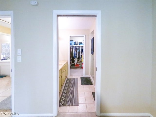 hallway with light tile patterned floors