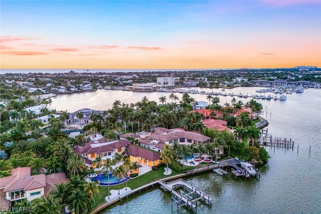 aerial view at dusk with a water view