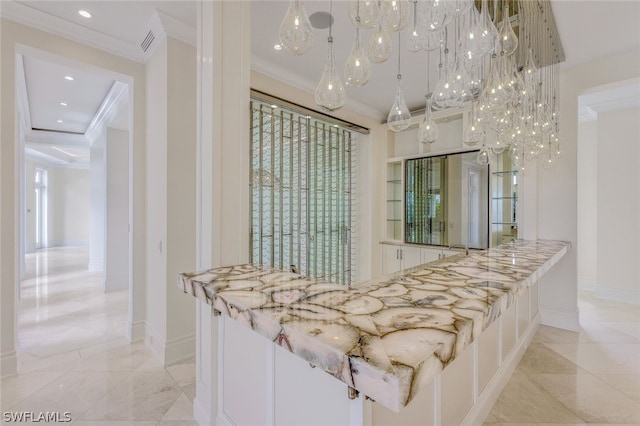 kitchen featuring crown molding, pendant lighting, and light tile floors