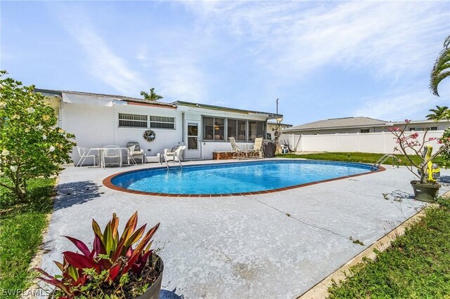 view of pool featuring a patio area