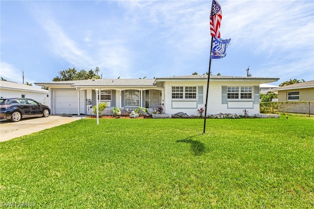 ranch-style home featuring a garage and a front lawn