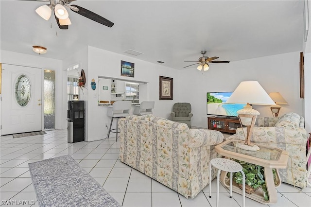 living room featuring ceiling fan and light tile patterned flooring