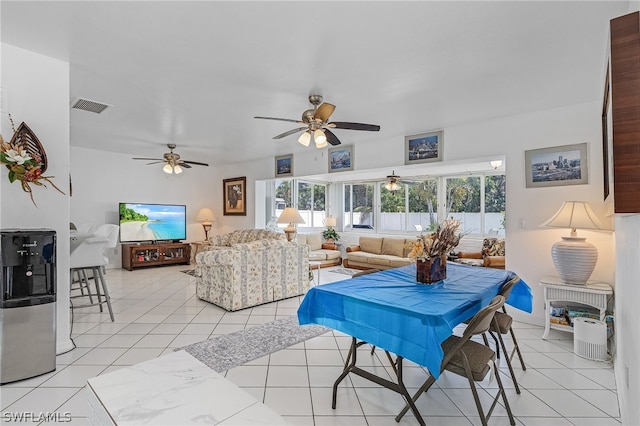 living room with light tile patterned floors and ceiling fan