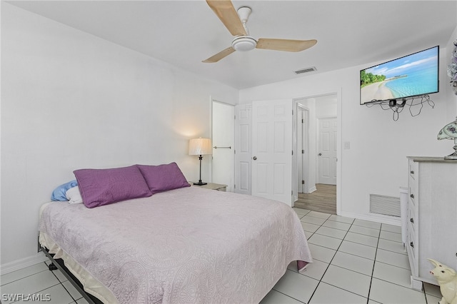 bedroom with light tile patterned floors and ceiling fan